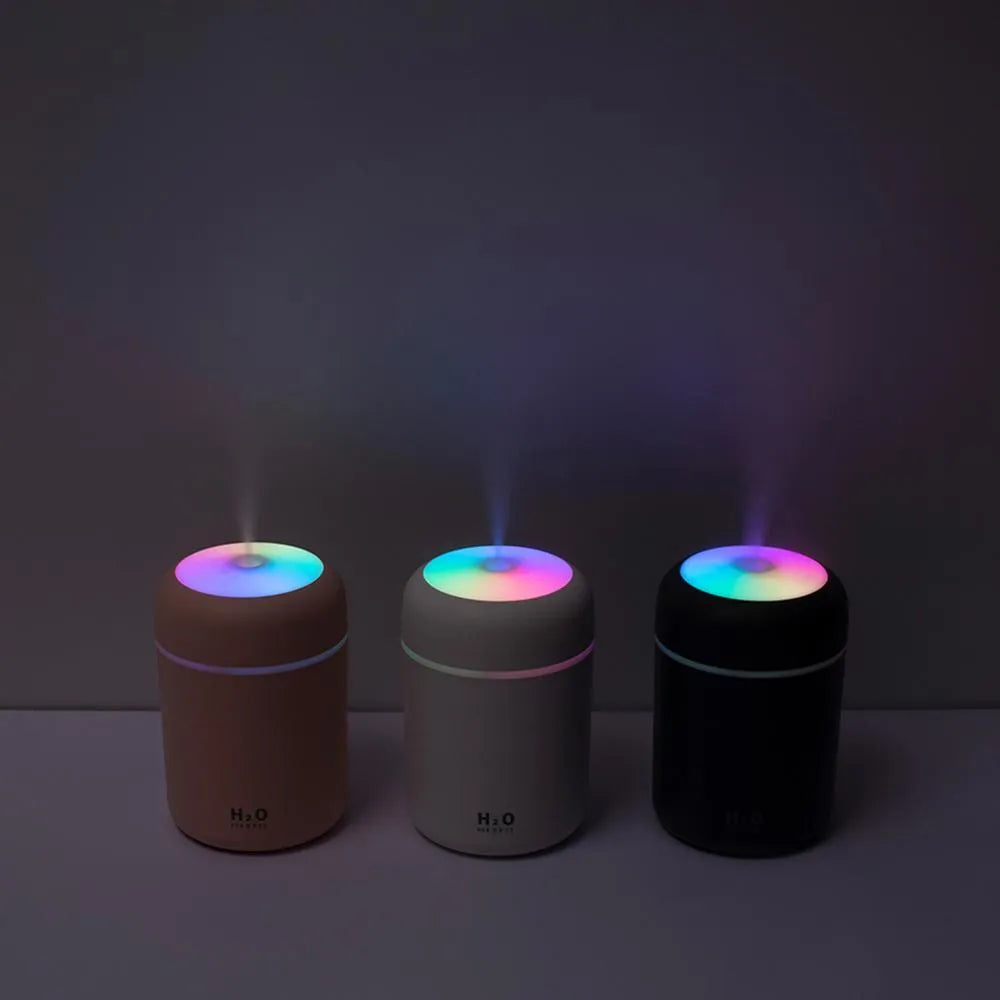 Pink USB desktop humidifier with LED lights and 300ml water tank