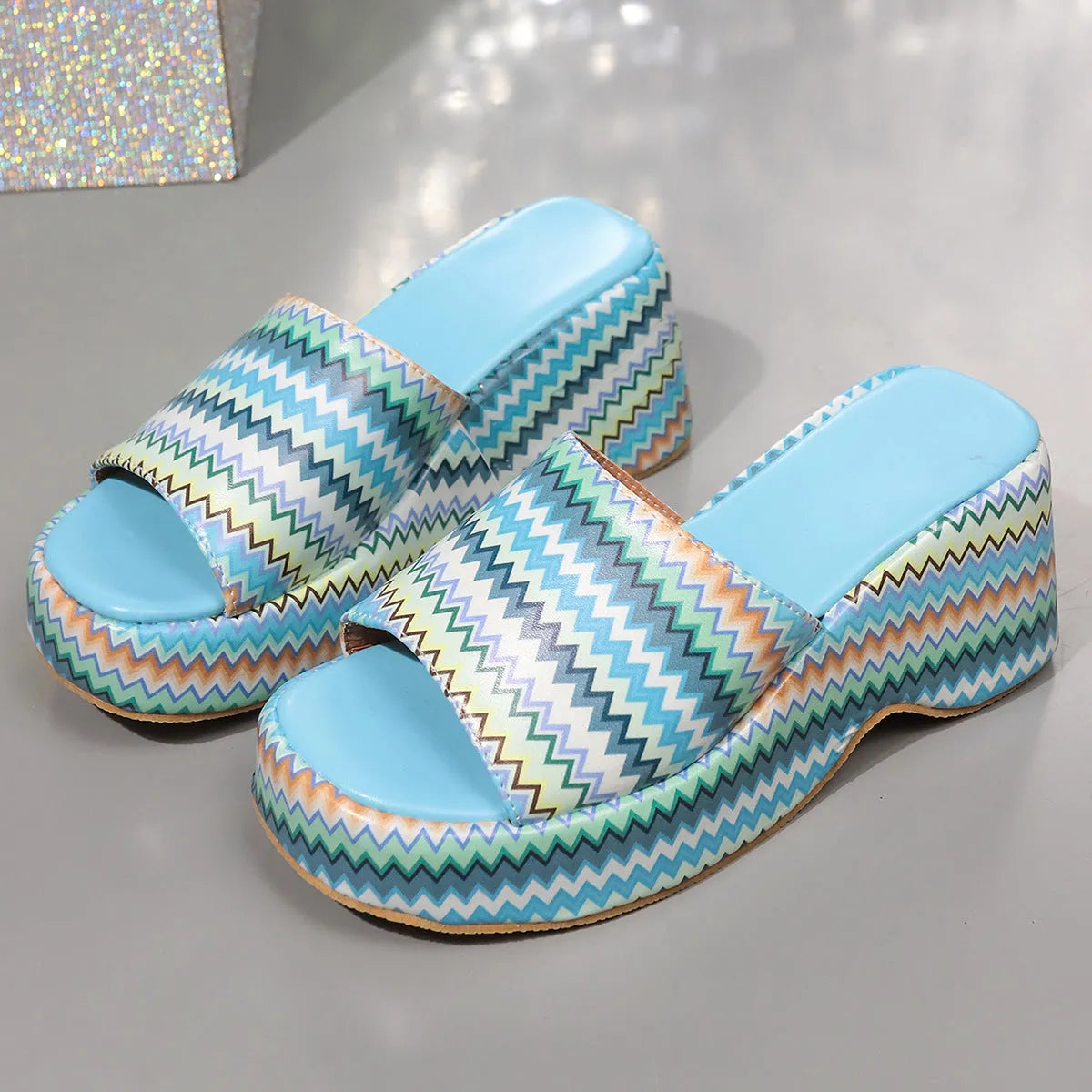 Women's colourful wave print wedge sandals with fish mouth toe and thick rubber sole.