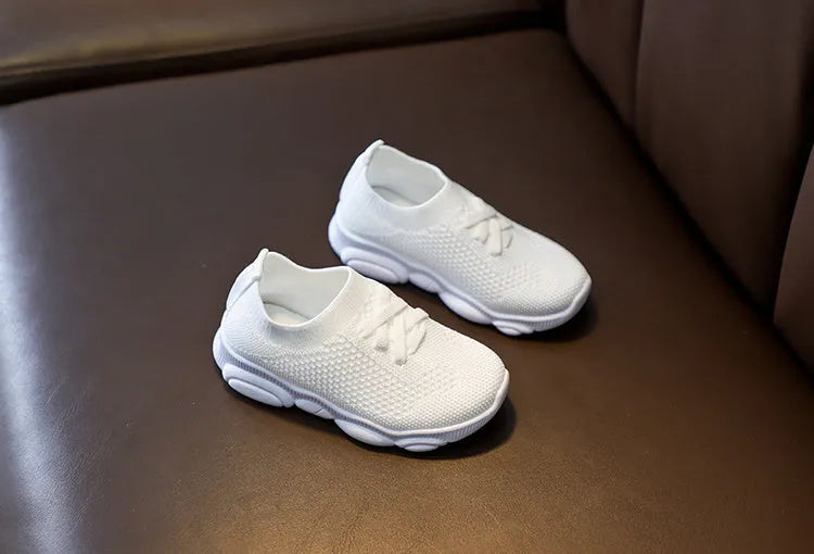 Children's fabric lazy shoes in white, black, pink, and grey colours with non-slip rubber sole