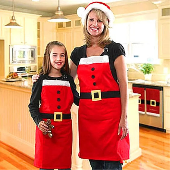 Red polyester Christmas apron with Merry Christmas text, shown in adult and children's sizes.