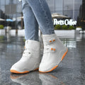 Set of waterproof silicone shoe covers in black, blue, orange, and white with non-slip soles
