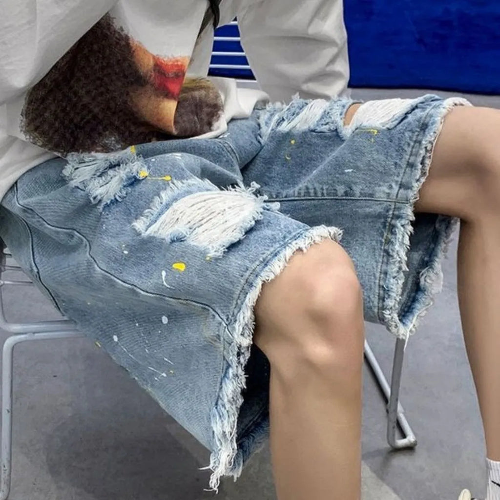 Men's loose fit denim shorts with water-washed finish and hole design in black colour