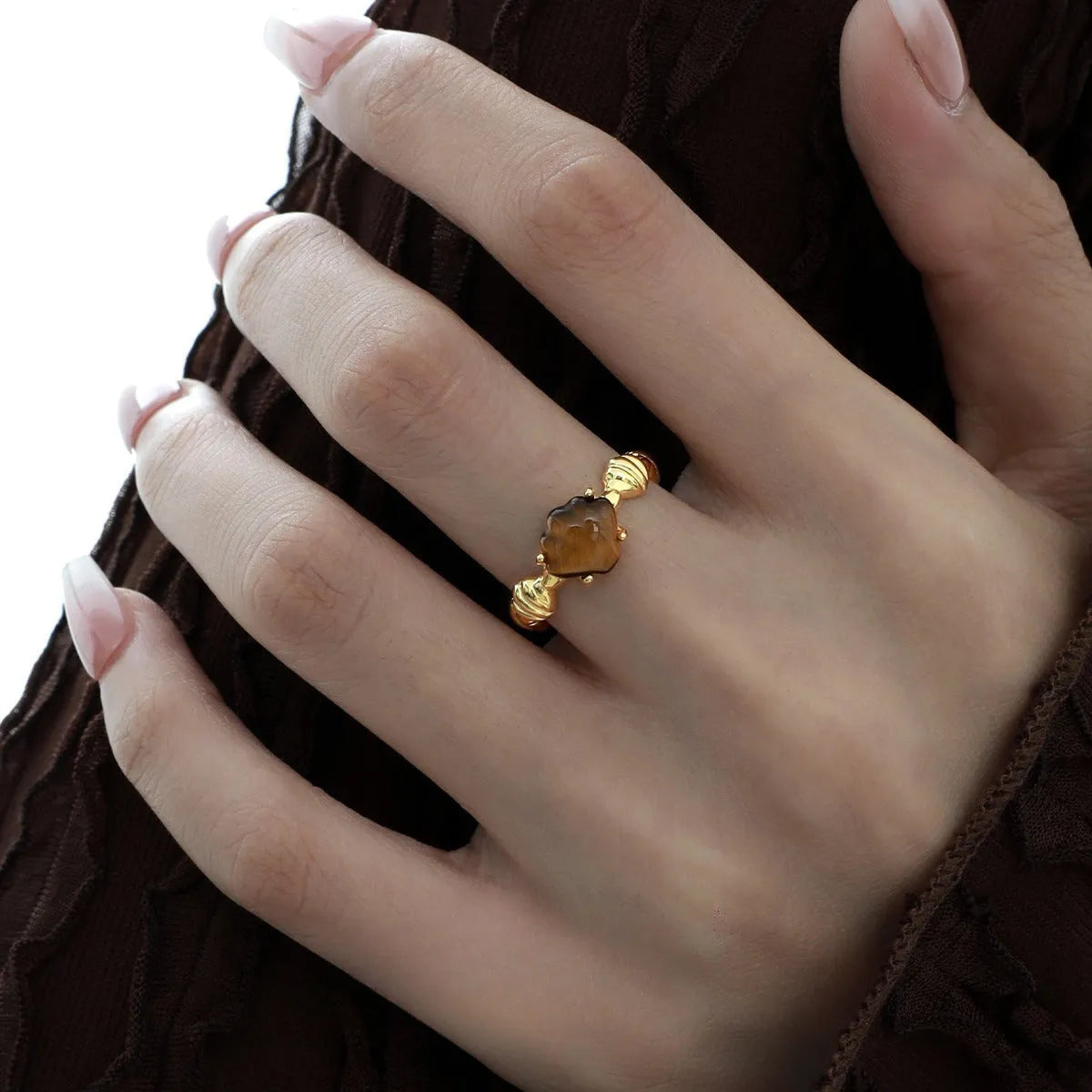 Women's adjustable silver ring with a shell tiger eye stone and white gold electroplating.