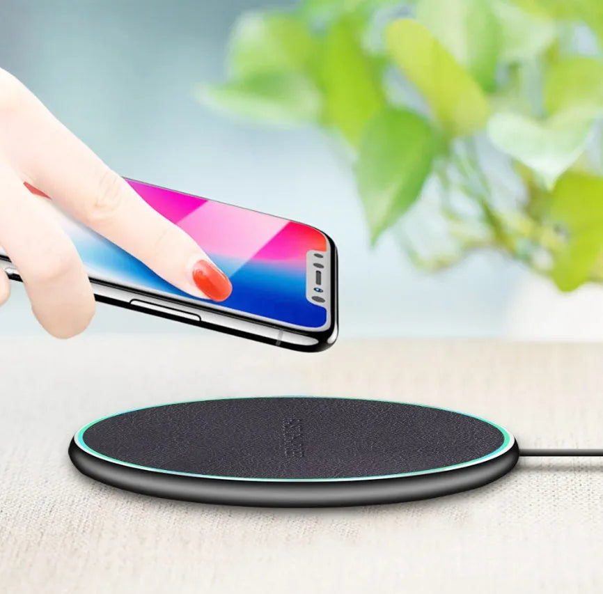 Black Qi wireless charging pad for iPhone 11 with non-slip surface and 10W fast charging
