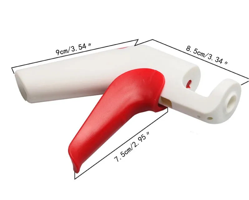 Cherry pitter kitchen tool with soft-grip handle and stainless steel plunger on a plastic base.