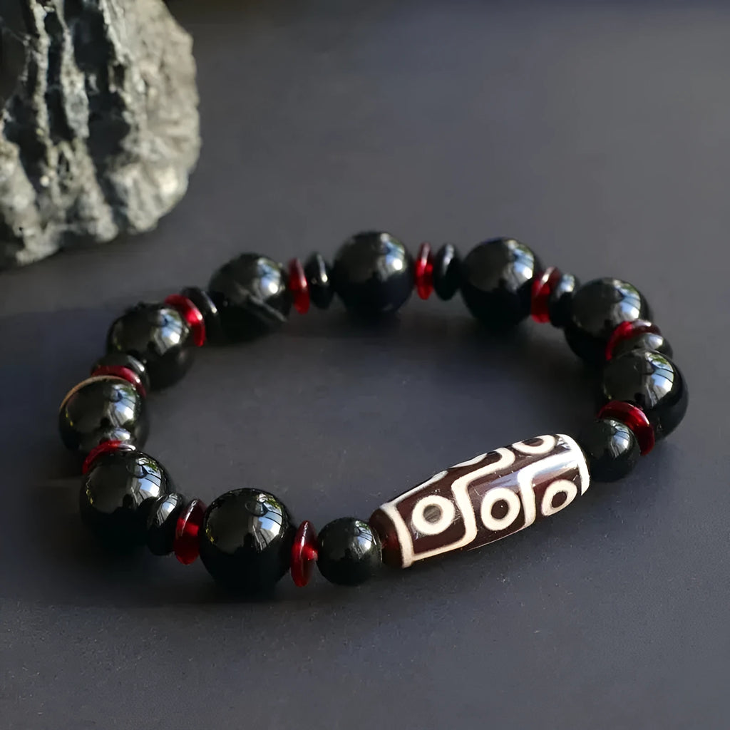 Black agate dzi bead bracelet with 11mm geometric beads in hand-woven construction