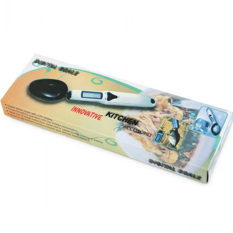 Stainless steel smart digital measuring spoon with a black LCD display showing weight measurement.