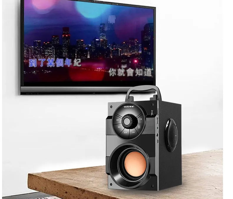 Black portable audio system with subwoofer and 3.5mm audio cable for connecting to phones and laptops
