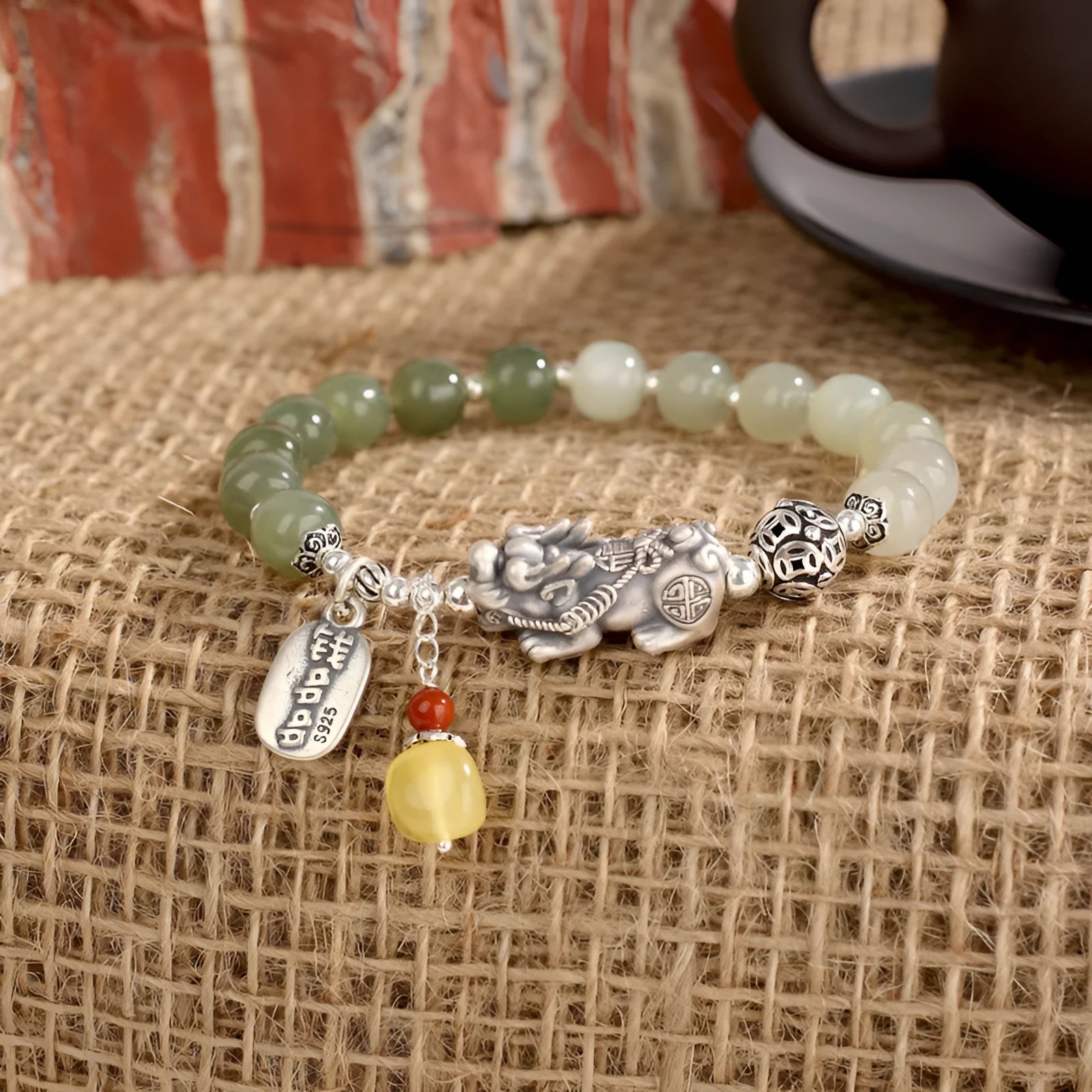 Retro-style pure silver bracelet for women with natural Hetian jade bead pendants.
