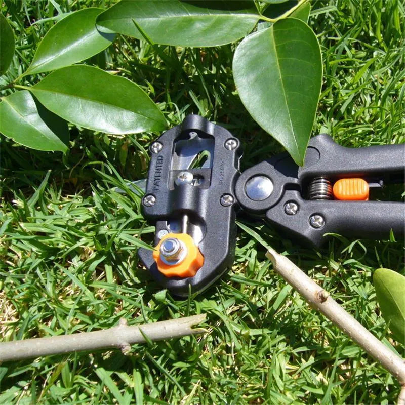 Black handheld grafting scissors with high carbon steel blade, open position showing U-shape cutting slot