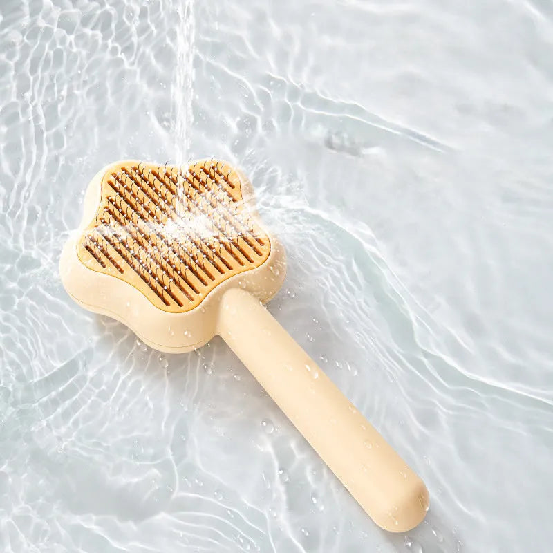 Magic Wand self-cleaning pet comb with stainless steel teeth in green colour