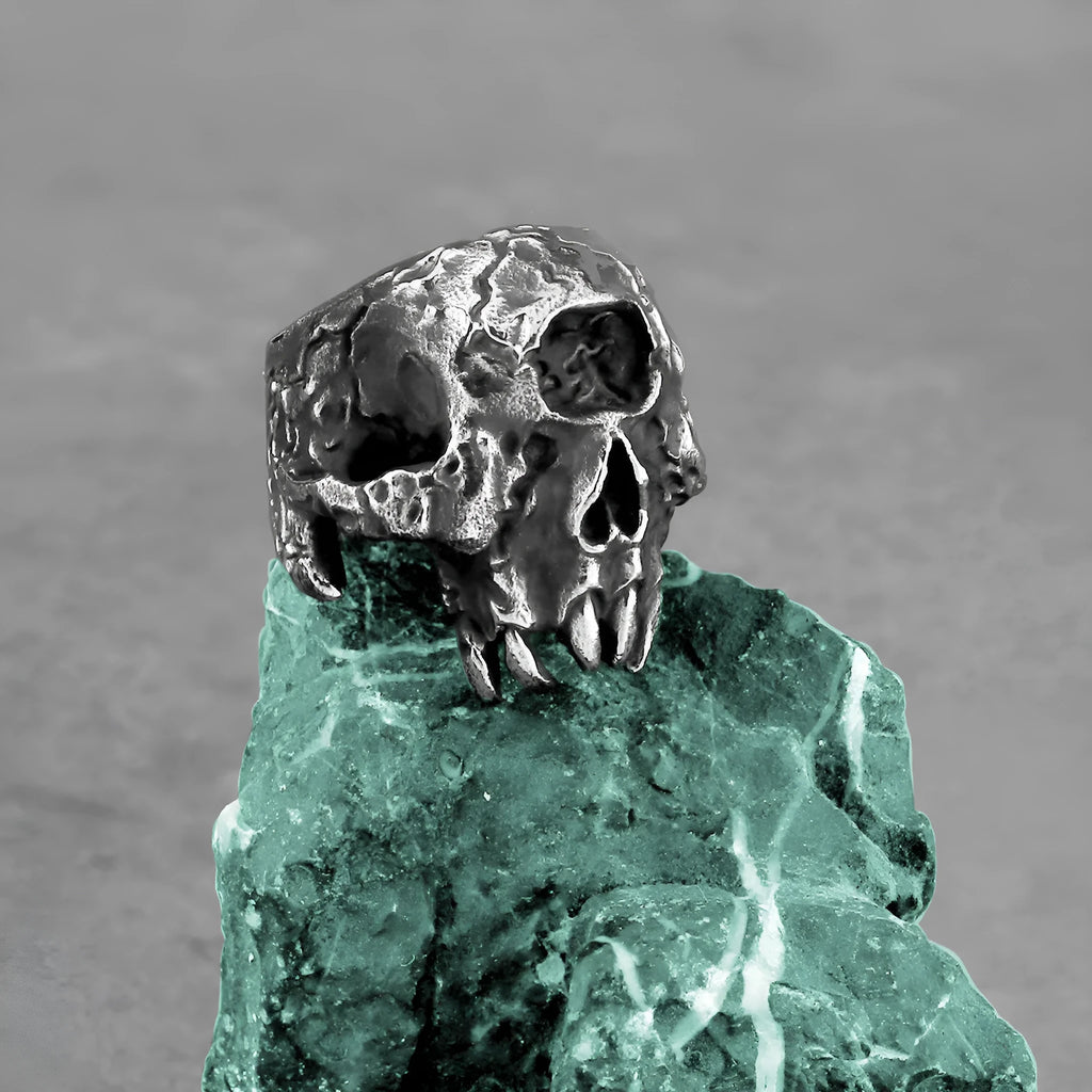 A retro-style alloy ring with a one-eyed skull design, shown in silver tone.