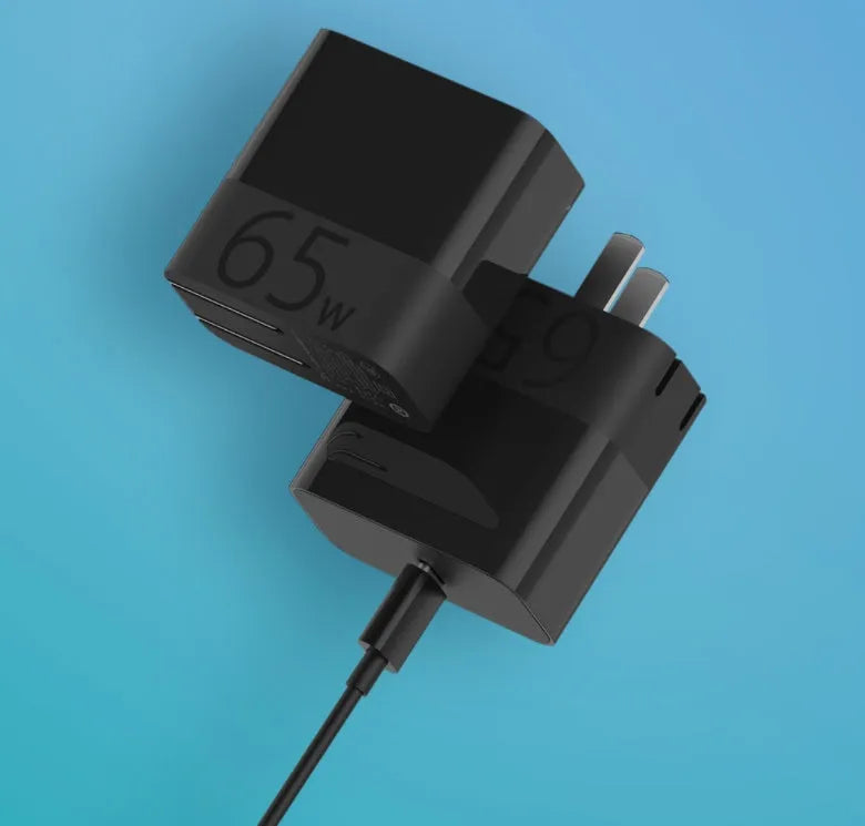 Black ZMI USB-C 65W notebook power adapter with compact design.