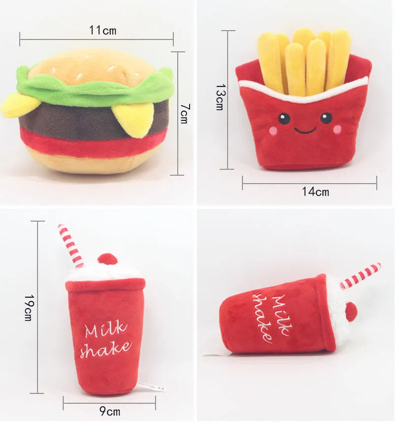 Set of three colourful fast food plush pet toys: red hamburger, yellow french fries, and pink milkshake cup on a white background.