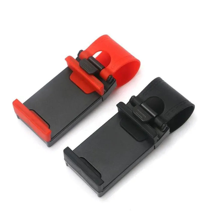 Black universal steering wheel phone holder clip mount attached to a car steering wheel.