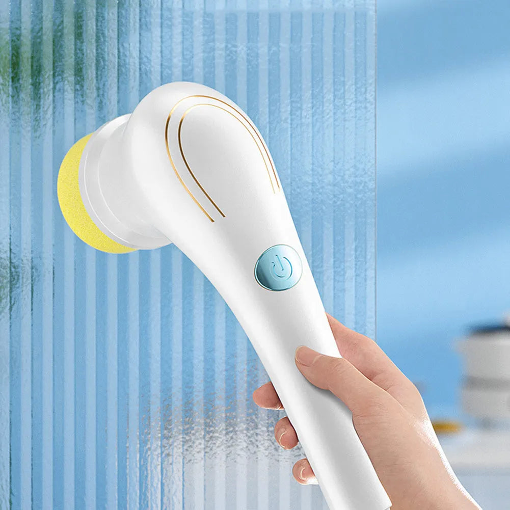 White cordless electric handheld scrubber with five cleaning brush heads on USB charging cable