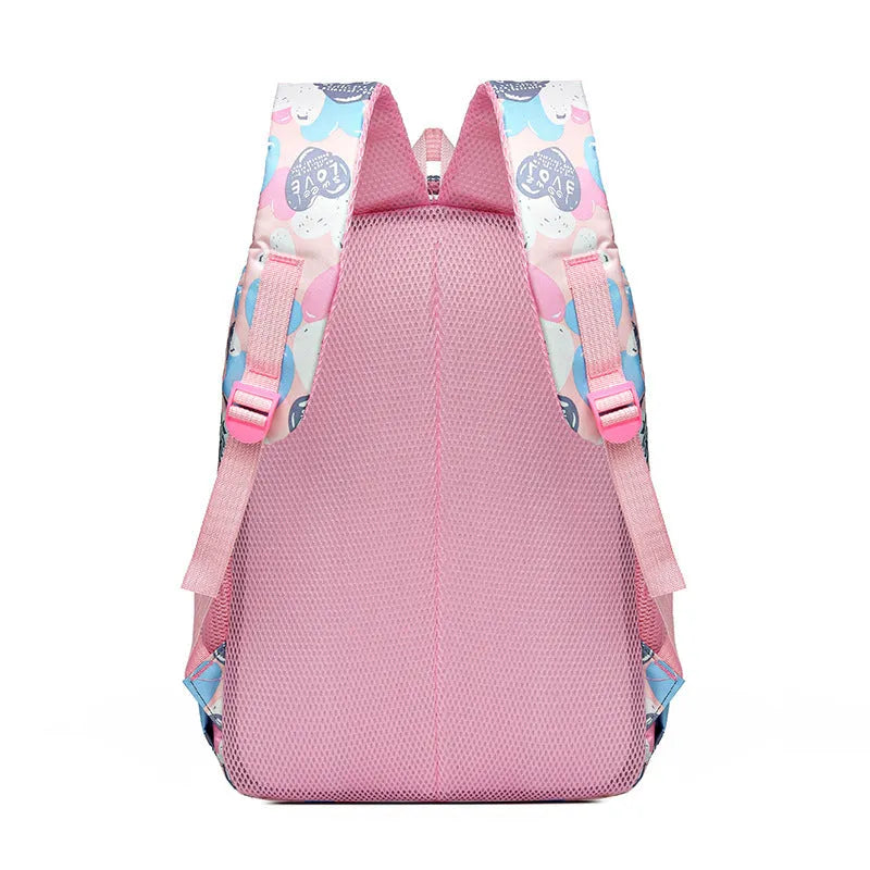 Large blue school backpack with air pillow belt straps on a grey background.