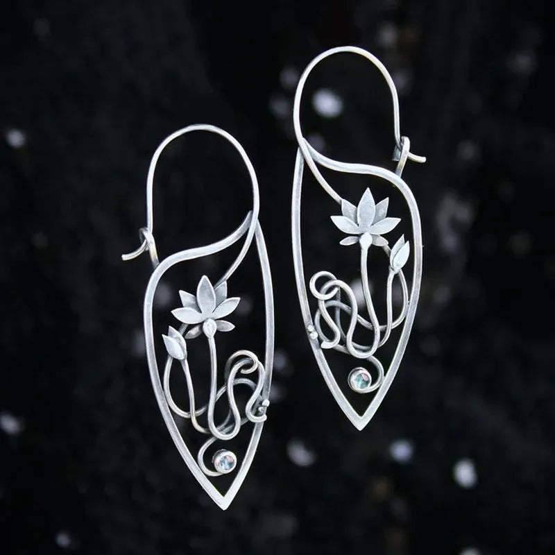 Silver lotus flower vine earrings with geometric rhinestone accents and retro styling