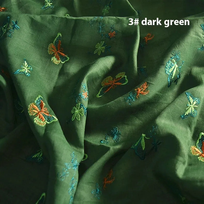 Pure ramie Hanfu fabric showing texture detail with beige, dark green, and grass green colour options