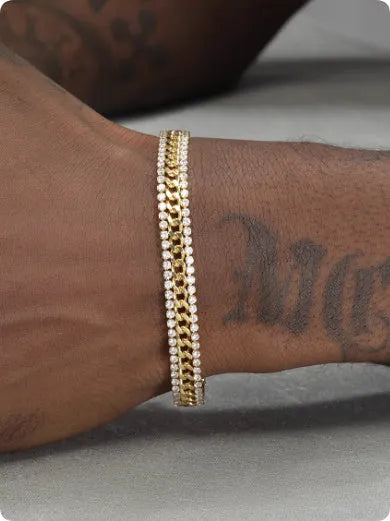Gold-coloured titanium steel tennis bracelet with artificial gemstone inlay and a clasp.