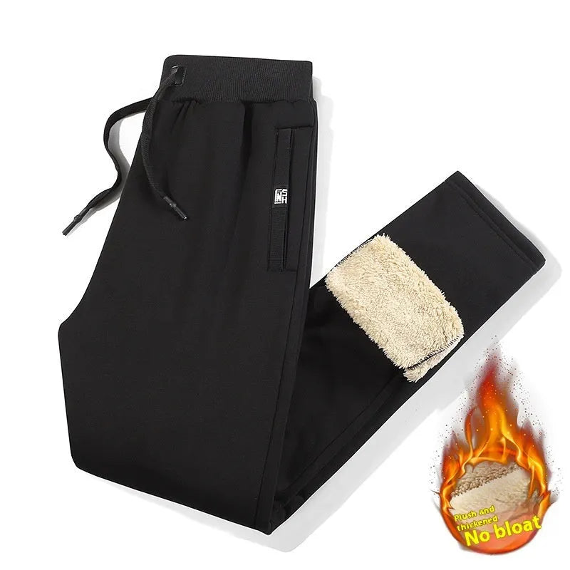 Men's black fleece-lined oversized track pants with drawstring ankles