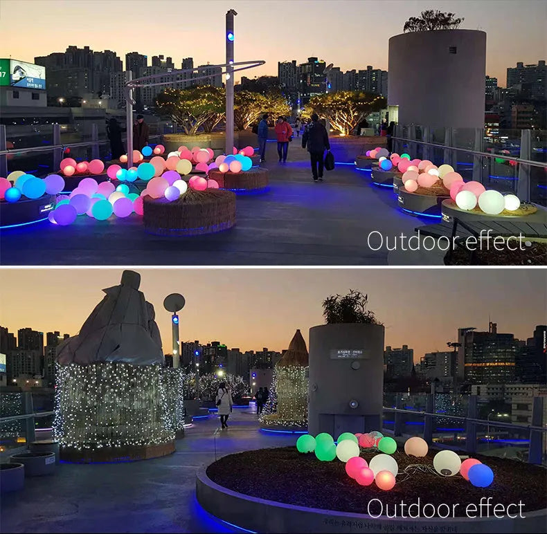 Remote control LED ball-shaped lawn lamp lit up with multi-colours on a garden patio.