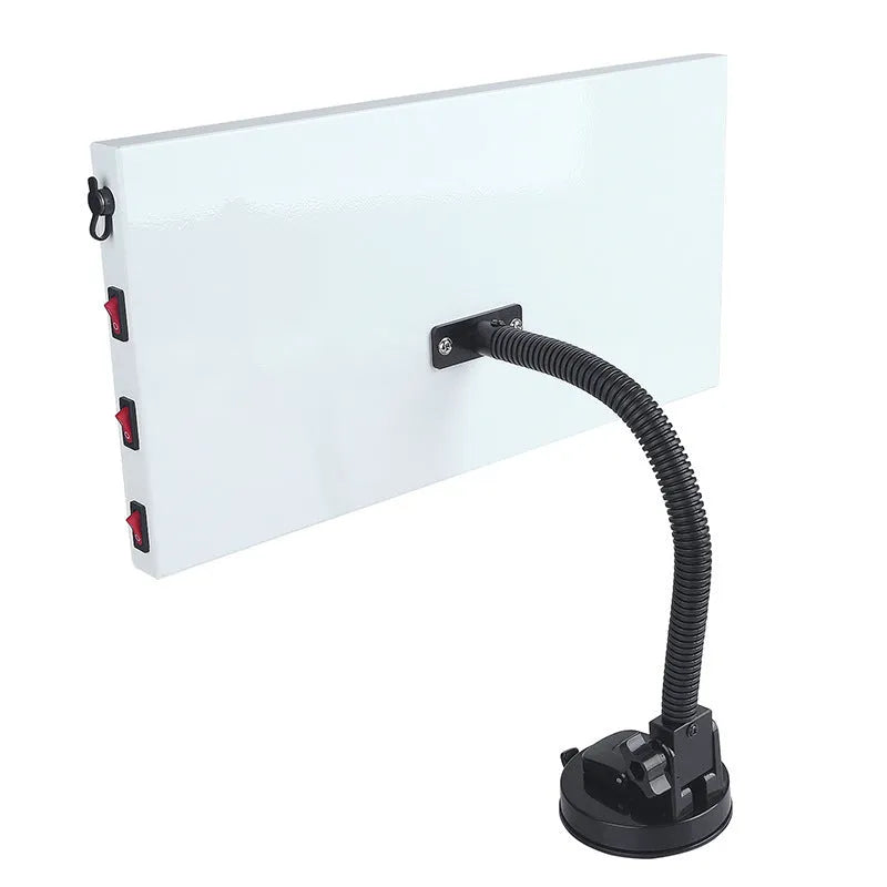 White MPT X009 car dent repair detector suit and concave inspection light on a workbench.