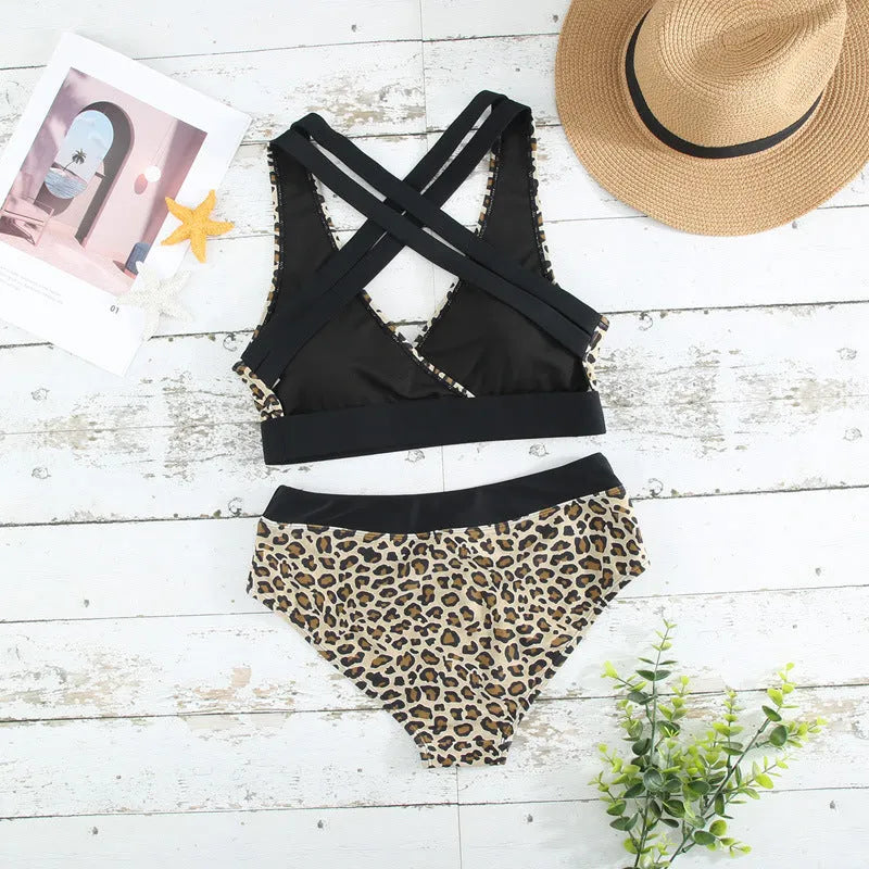 Leopard print women's bikini swimsuit with V-neck and split side design on a mannequin.