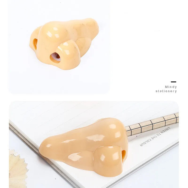Flesh coloured plastic pencil sharpener with geometry shape on a white background.