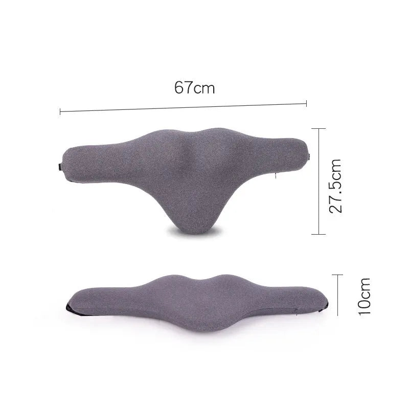 Dark grey memory foam car neck pillow on a car headrest.