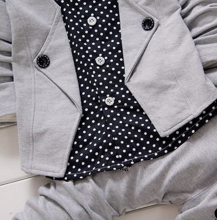 Casual blue kids sport suit consisting of a short-sleeved top and long trousers on a child mannequin.