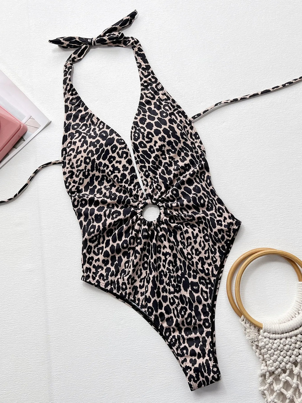 Women's leopard print one-piece swimsuit featuring a hollow-out ring design detail on the front.