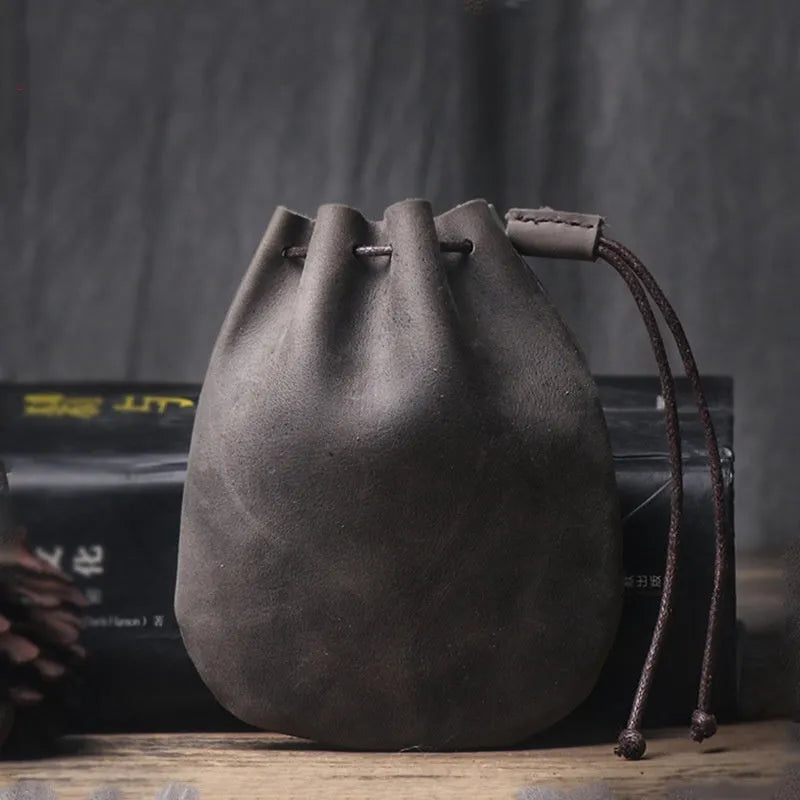 Genuine cowhide leather drawstring bundle wallet in retro style shown in black and chocolate colours.