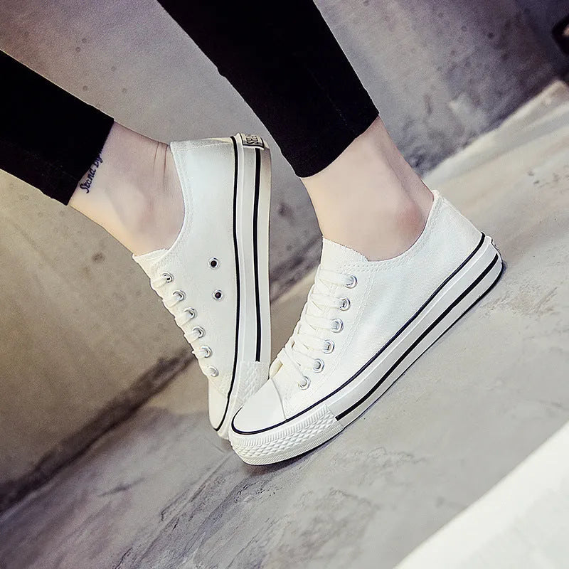 Women's solid colour canvas casual shoes shown in black, white black, white red, and all black.