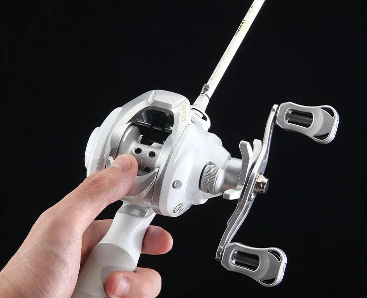 White drop wheel fishing reel with left or right hand retrieve for micro jigging and bait casting