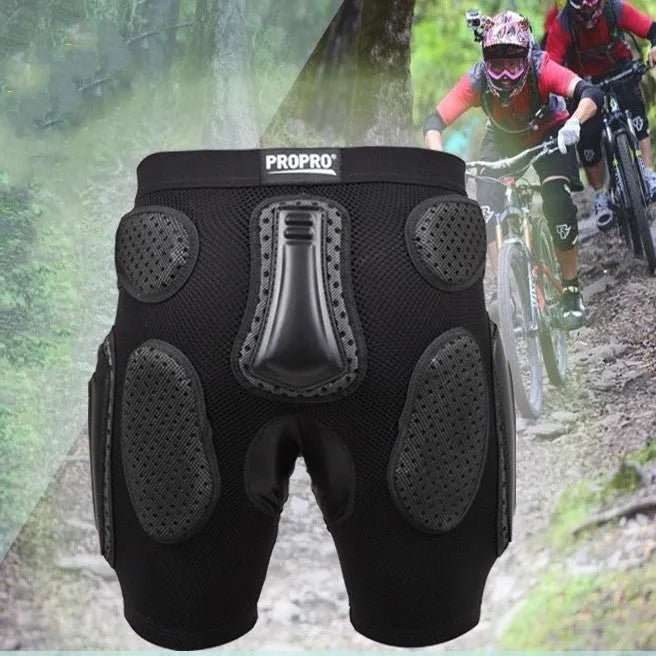 Black cycling hip protection pants with integrated pad, shown laid flat.