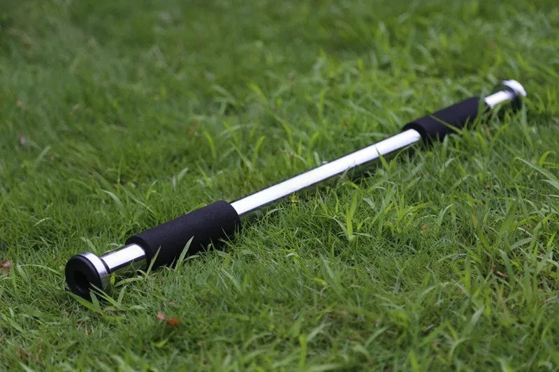 Steel adjustable indoor pull-up bar extended for door frame fitness training.