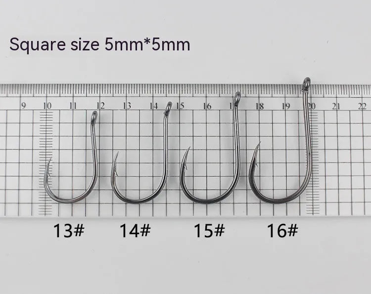 Bulk pack of alloy carbon steel barbed fishing hooks in various sizes for sea and rock fishing.