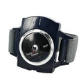 Black ABS anti snore wristband with biosensor and infrared therapy displayed on a flat surface