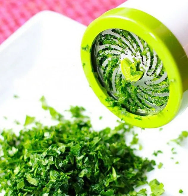 Manual PP plastic herb grinder with stainless steel blades and a removable top, shown upright.