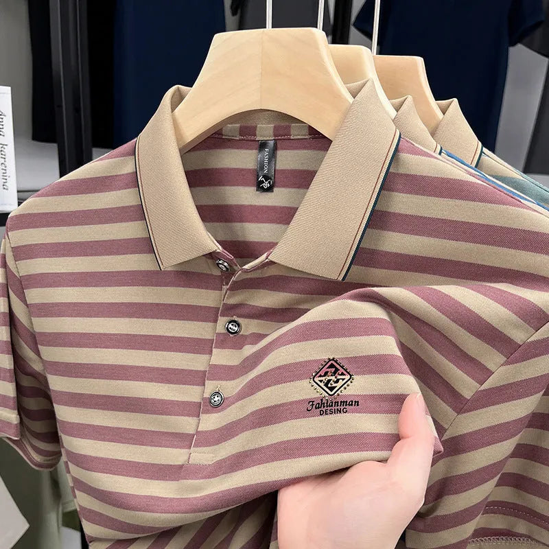 A man wearing a red striped casual t-shirt with a mosaic pattern detail on the fabric.