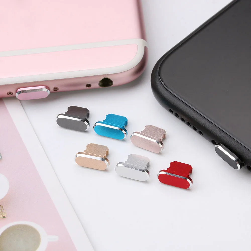 Aluminium alloy iPhone charging port dust plug shown in gold, silver, and rose gold colours.