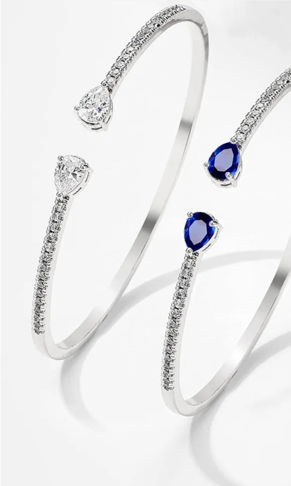 Multi-zircon personalised bracelet with inlaid stones on copper base in white and blue colour options