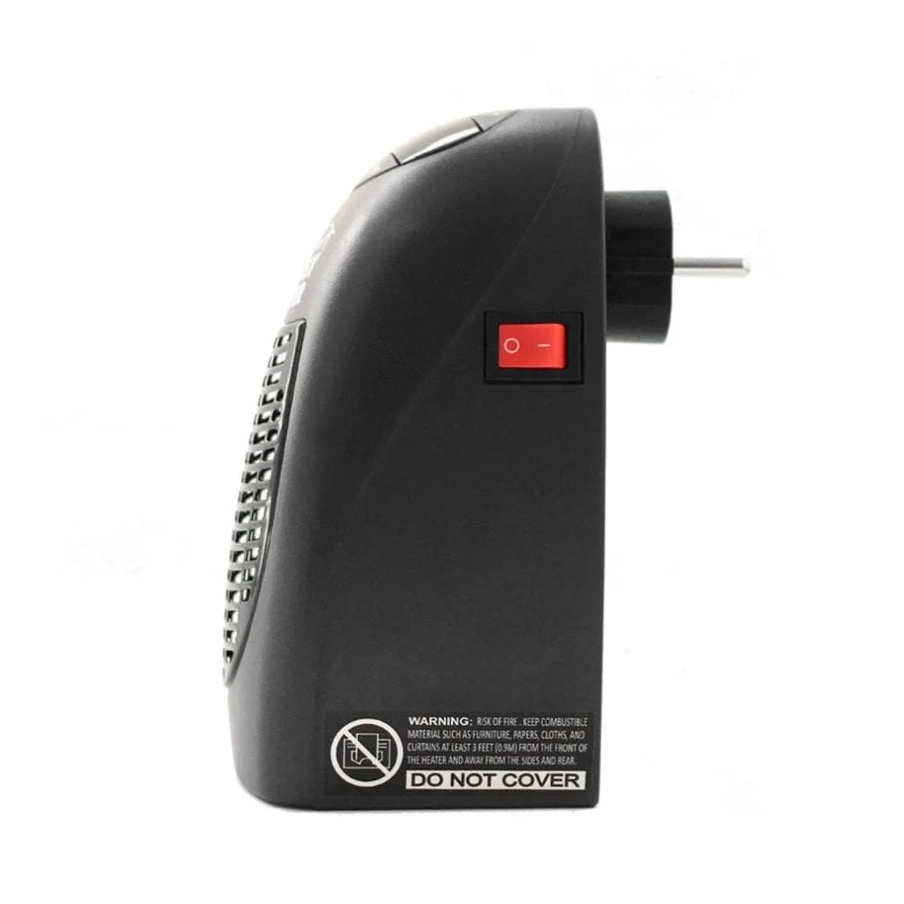 Black mini electric heater with digital display and a rotating plug on a table.
