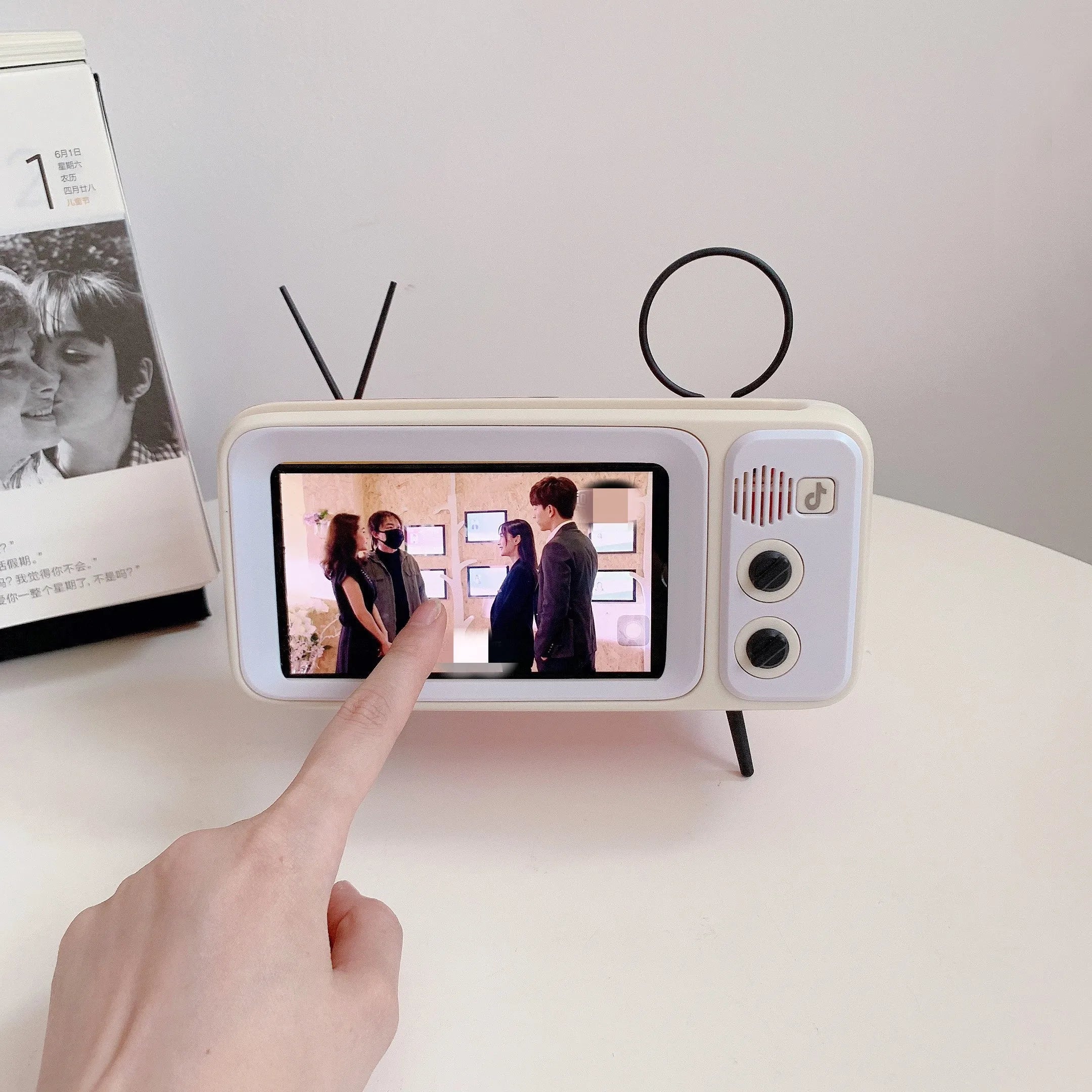 Vintage wooden TV Retro phone stand with built-in speaker, Bluetooth connectivity, and phone placed on top