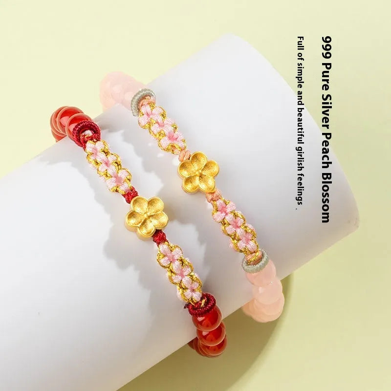 Hand-woven women's bracelet with natural crystal peach blossom charm and adjustable rope strap