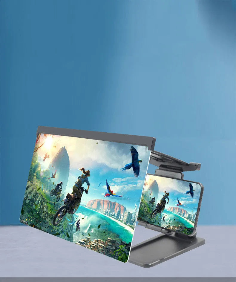 Black foldable mobile phone screen magnifier with a detachable phone holder on a desk.