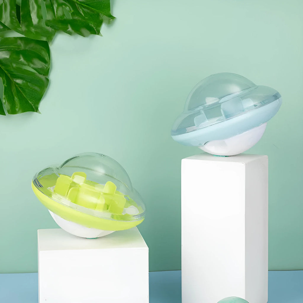 Blue pet tumbler ball toy with clear visual cabin and labyrinth column on floor