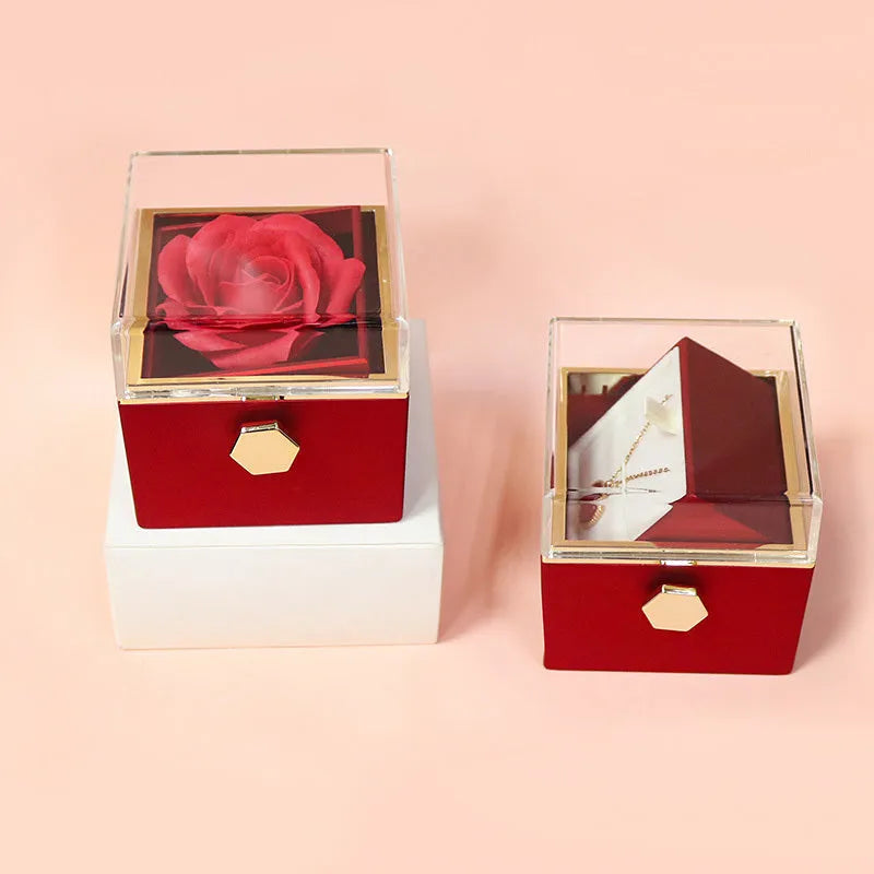 Rotating rose jewellery gift box with preserved real flower under acrylic cover and rotating drawer