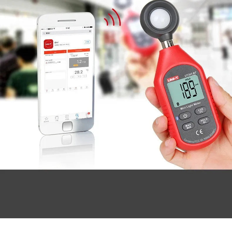 Mini lux meter UT383 with backlit display showing light reading in handheld use
